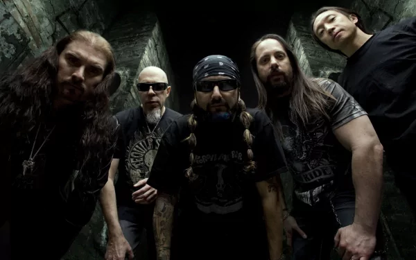 A striking HD wallpaper featuring the members of Dream Theater, captured in dramatic lighting, exuding their signature rock energy and presence in an atmospheric setting.