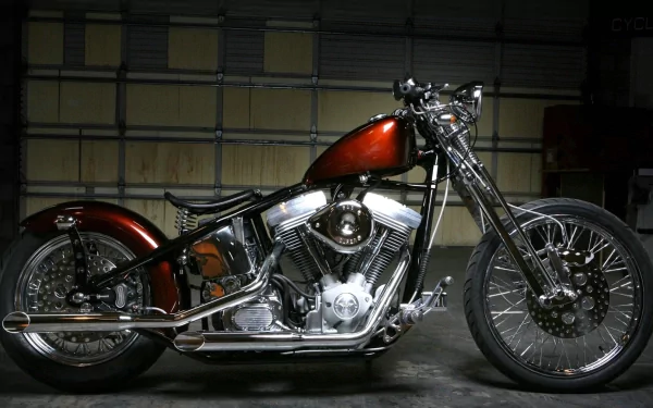 A polished Harley-Davidson motorcycle showcased in a dimly lit garage, featured as an HD PC desktop wallpaper and background.