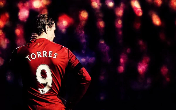 HD PC desktop wallpaper featuring footballer Fernando Torres in a red jersey with the number 9, set against a vibrant, blurred stadium light background.