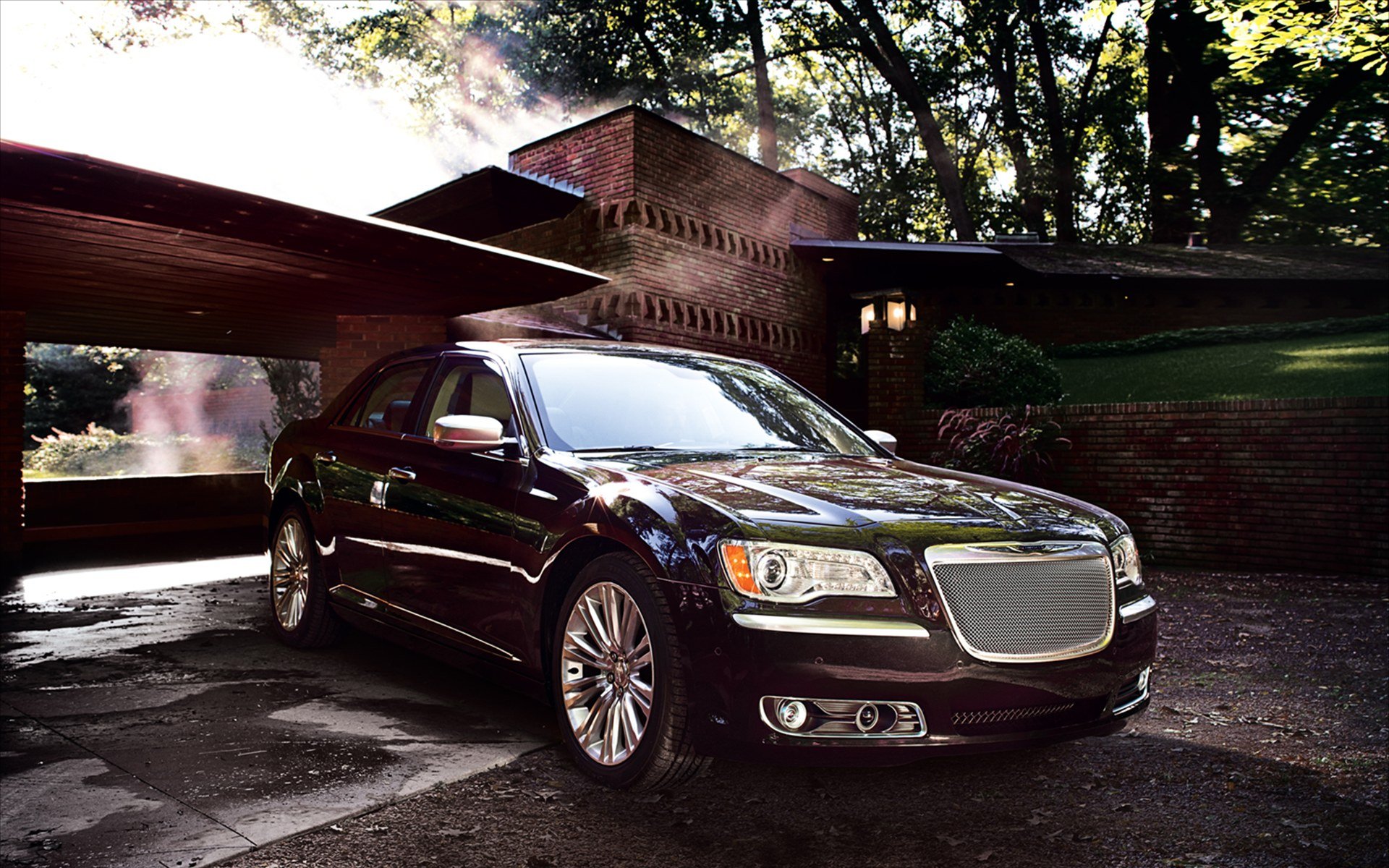 HD PC desktop wallpaper showing a Chrysler 300 luxury vehicle — dark sedan parked by a modern house, wet driveway reflecting dramatic morning light.