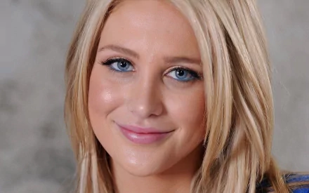 Close-up of celebrity Stephanie Pratt with blonde hair, blue eyes, and a warm smile, featured in an HD PC desktop wallpaper.