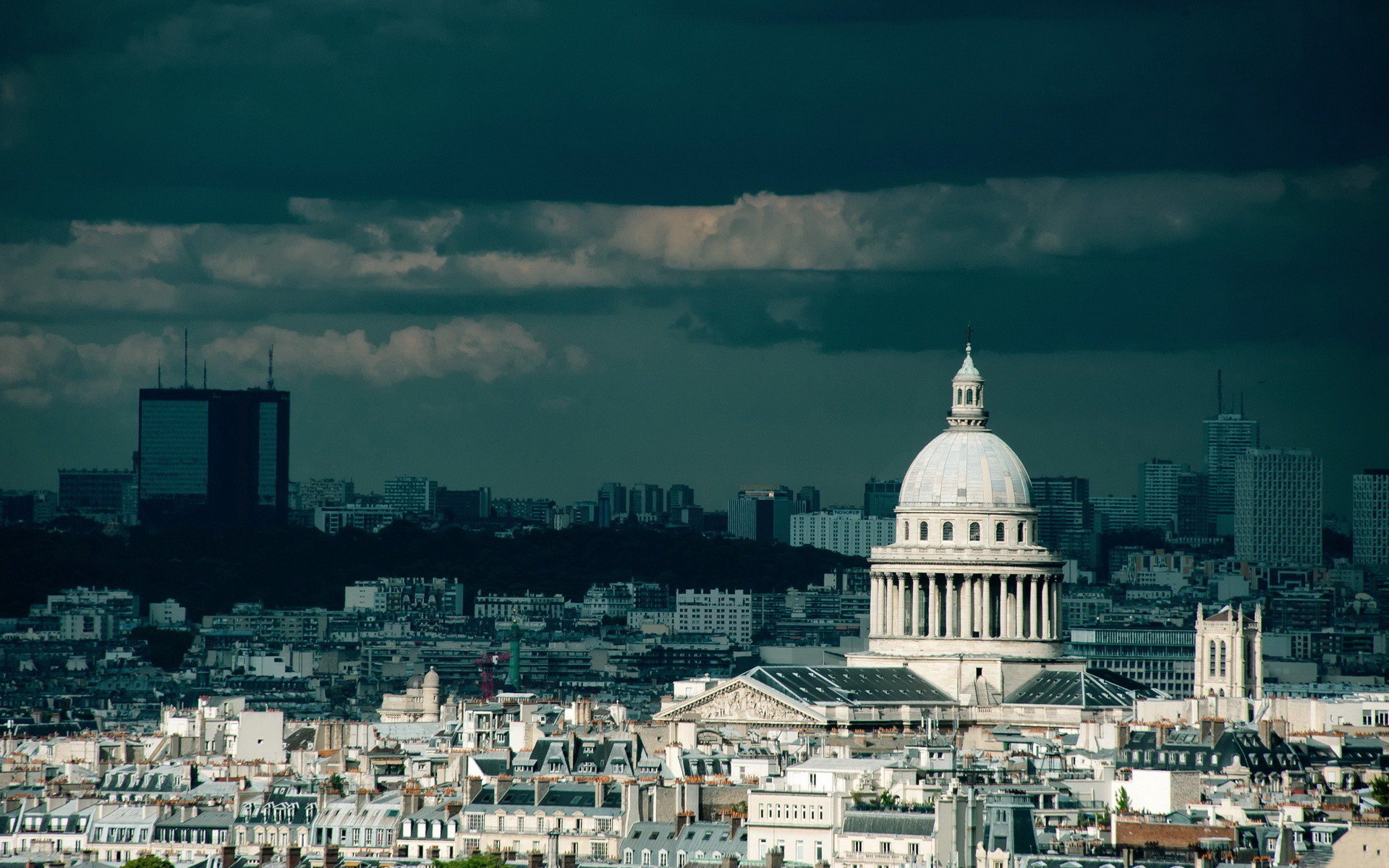 HD desktop wallpaper of the Pantheon in Paris, France, showcasing the historic man-made landmark under a dramatic cloudy sky.