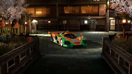 HD PC desktop wallpaper of a vibrant sports car parked on a traditional street at night, blending modern speed with classic architecture under soft lighting.