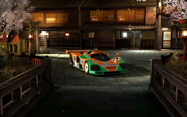 HD PC desktop wallpaper of a vibrant sports car parked on a traditional street at night, blending modern speed with classic architecture under soft lighting.