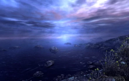 HD PC desktop wallpaper from the video game Dear Esther, featuring a serene coastal scene under a moody, cloudy sky with rocky shoreline and calm waters.