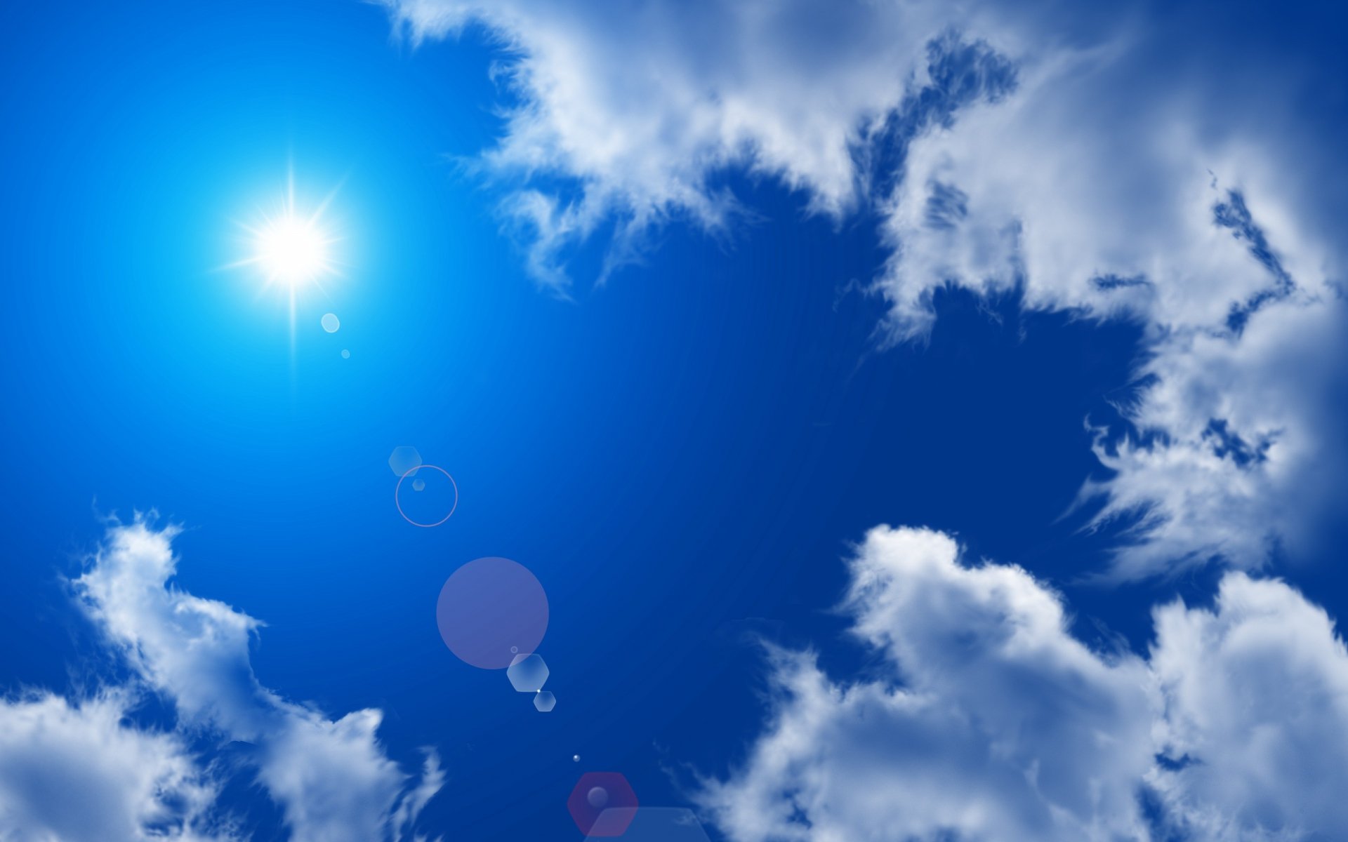 2K Quad HD PC desktop wallpaper: vivid blue sky with sun flare and scattered white clouds — nature cloud background.