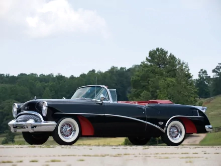 1954 Buick Skylark convertible (1953 Buick Skylark Convertible Coupe) — black classic vehicle with red interior and whitewall tires parked on a country road, HD desktop wallpaper.