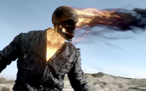 HD PC desktop wallpaper featuring Ghost Rider: Spirit of Vengeance with a flaming skull and fiery head against a rocky landscape backdrop.