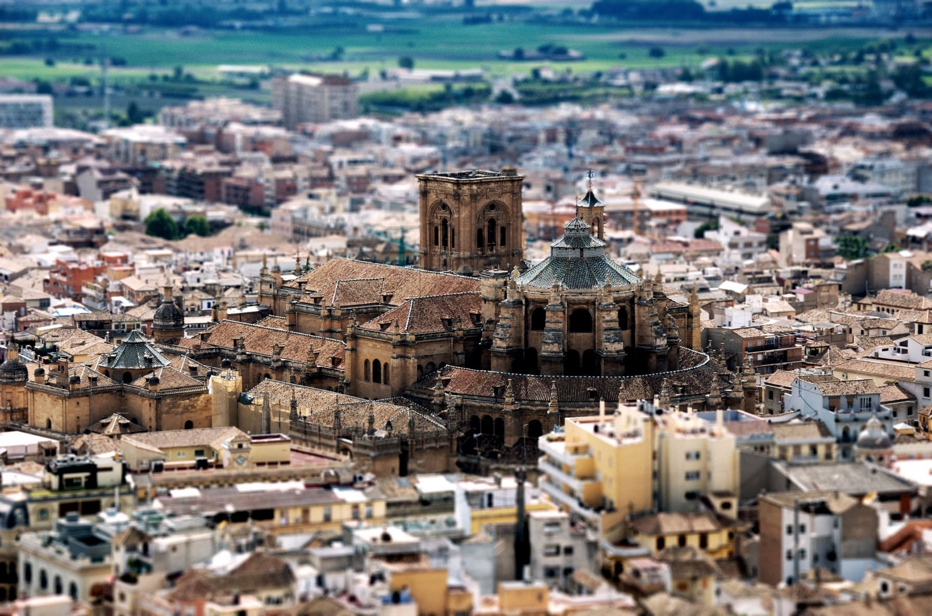 A tilt-shift photography image showcasing a detailed miniature-like cityscape, captured in high definition as a PC desktop wallpaper and background.