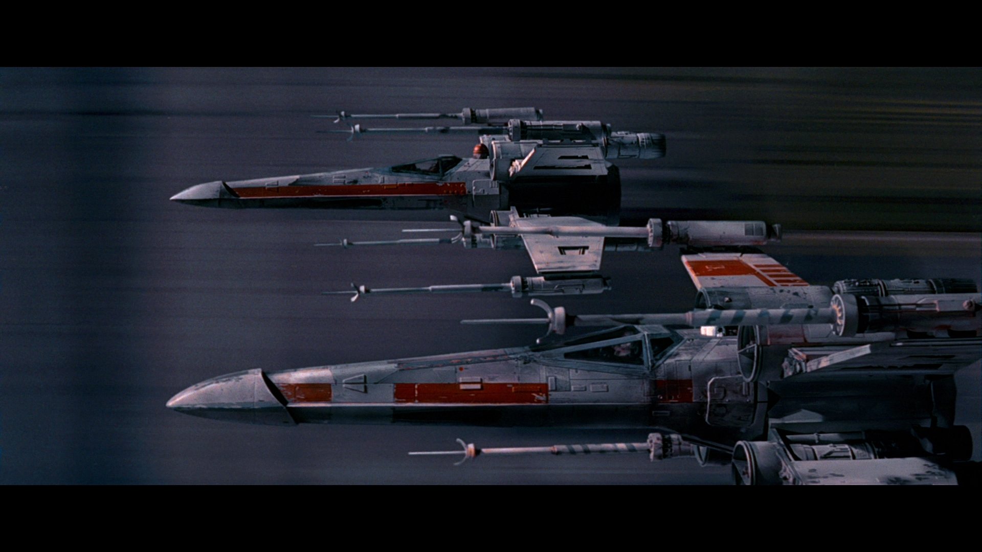 A dynamic HD desktop wallpaper featuring iconic Star Wars X-wing starfighters in flight, capturing the essence of sci-fi adventure and space exploration.