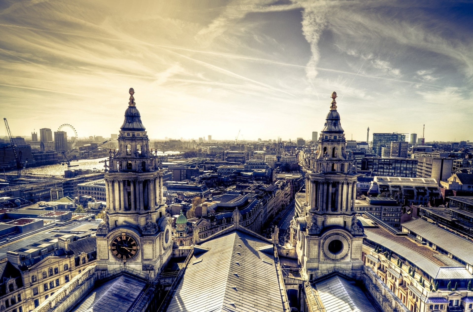 2K Quad HD PC desktop wallpaper of man-made London: ornate cathedral towers and an expansive city skyline beneath dramatic skies.