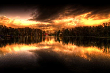 Scenic nature view of a calm lake reflecting a dramatic sunset sky, captured in HD for PC desktop wallpaper and background.