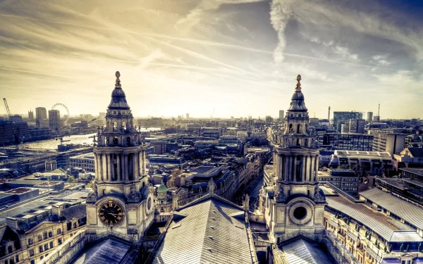 2K Quad HD PC desktop wallpaper of man-made London: ornate cathedral towers and an expansive city skyline beneath dramatic skies.