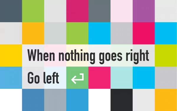 A colorful HD desktop wallpaper featuring a motivational quote: When nothing goes right, Go left, set against a vibrant, playful design.