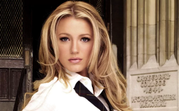 Blake Lively poses confidently in a stylish outfit against a backdrop of classic architecture, creating an engaging HD desktop wallpaper and background.