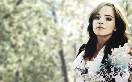 HD desktop wallpaper featuring celebrity Emma Watson, set against a serene, blurred natural background with soft, artistic floral elements.