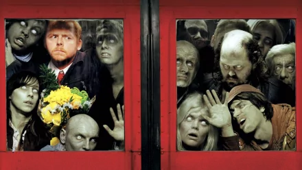A striking HD wallpaper from Shaun of the Dead, featuring an array of zombies pressing against red double doors, with a central character holding flowers amid the chaos.