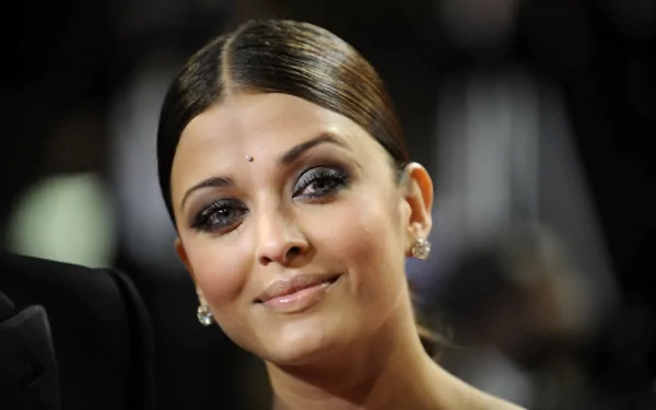 A stunning 4K Ultra HD desktop wallpaper featuring the celebrity Aishwarya Rai, showcasing her iconic beauty and elegant style in a captivating moment.