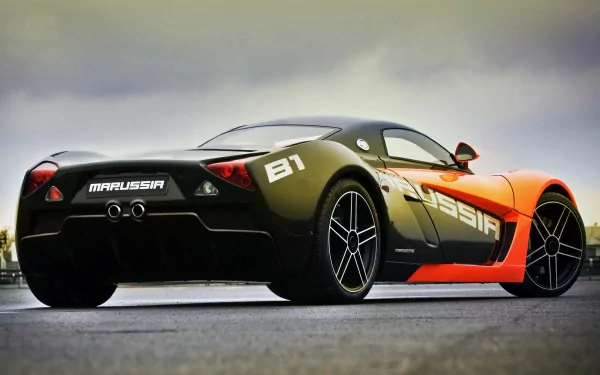HD desktop wallpaper featuring a sleek Marussia sports car with a striking black and orange design against a cloudy sky backdrop.