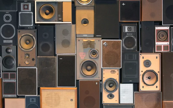 A 4K Ultra HD PC desktop wallpaper featuring a collage of vintage and modern speakers in various shapes and sizes, highlighting music-themed design elements.