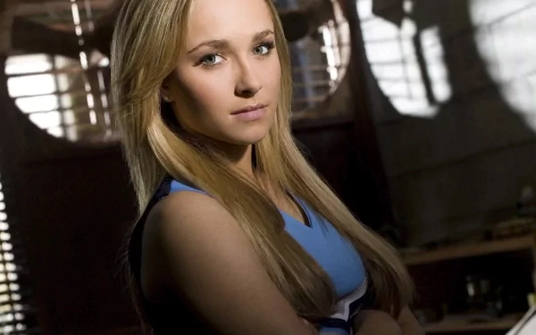 A stunning HD desktop wallpaper featuring celebrity Hayden Panettiere, showcasing her with a confident expression and soft lighting that enhances her features.
