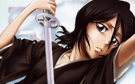 Rukia Kuchiki from the anime Bleach wields her sword with determination in this HD desktop wallpaper, showcasing her striking features and dynamic pose.