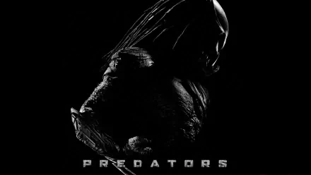 HD desktop wallpaper featuring a dark, shadowed image of the Berserker Predator from the movie Predators with the title text below.