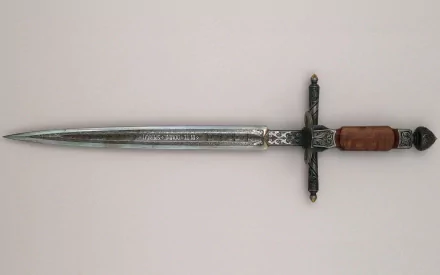 A detailed image of a man-made sword with a polished blade and ornate hilt, designed to serve as an HD desktop wallpaper or background, showcasing craftsmanship and elegance.