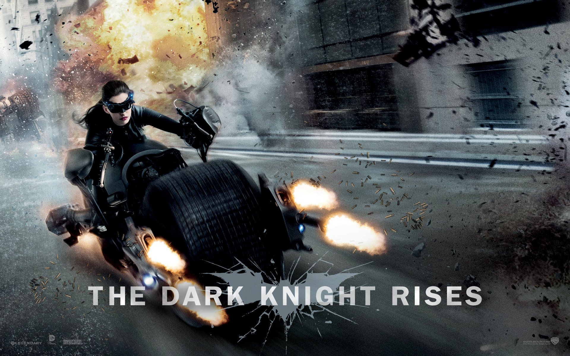 HD PC desktop wallpaper featuring a dynamic scene from the movie The Dark Knight Rises with Batman riding the Batpod amidst an explosion.