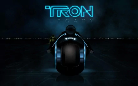 HD desktop wallpaper featuring a sleek motorcycle from the movie TRON: Legacy, set against a dark, futuristic background with glowing blue text.