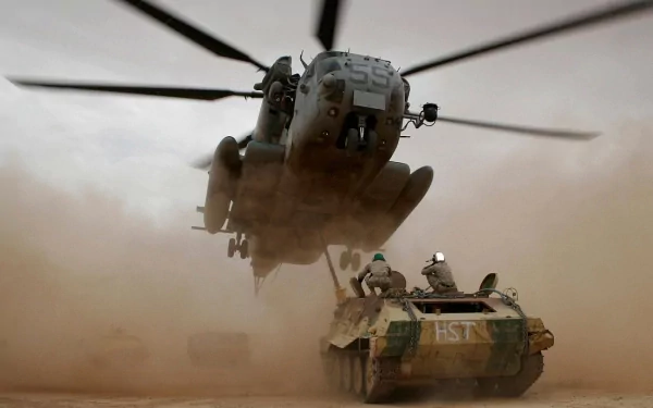 Military Sikorsky MH-53 helicopter hovers low over desert terrain, kicking up dust above armored vehicle, captured in HD for a dynamic PC desktop wallpaper background.