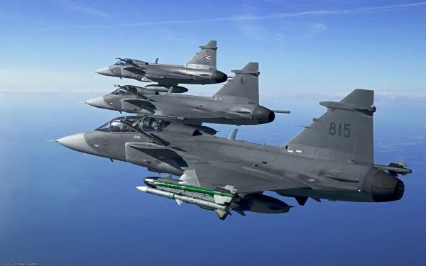 HD desktop wallpaper featuring a formation of military jet fighters flying over a vast blue ocean, tagged with military and jet fighter.