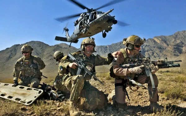HD desktop wallpaper featuring a group of military soldiers in tactical gear with a helicopter flying overhead in a rugged mountainous desert landscape.