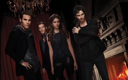HD wallpaper featuring characters from the TV show The Vampire Diaries, set against a moody background with elegant decor and a flickering fireplace.