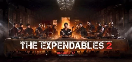 A dramatic HD wallpaper featuring the ensemble cast of The Expendables 2, showcasing iconic action stars in a gritty setting with the film's title prominently displayed.