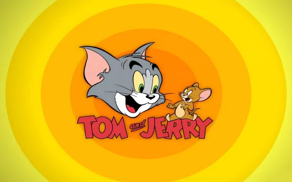 HD desktop wallpaper featuring the characters Tom and Jerry from the TV show Tom And Jerry. The artwork shows their animated faces on a yellow and orange background with the show’s title beneath them.