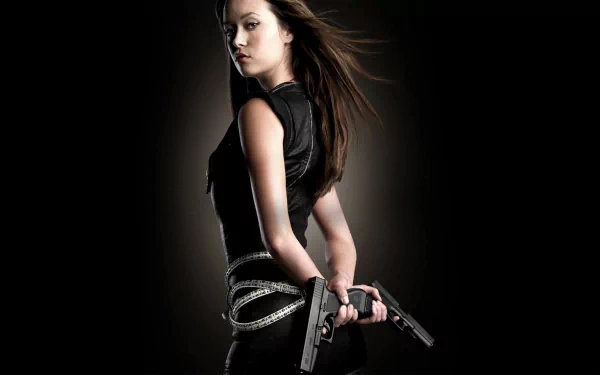 HD desktop wallpaper featuring Summer Glau as Cameron Phillips from the sci-fi TV show Terminator: The Sarah Connor Chronicles, holding dual pistols against a dark background.