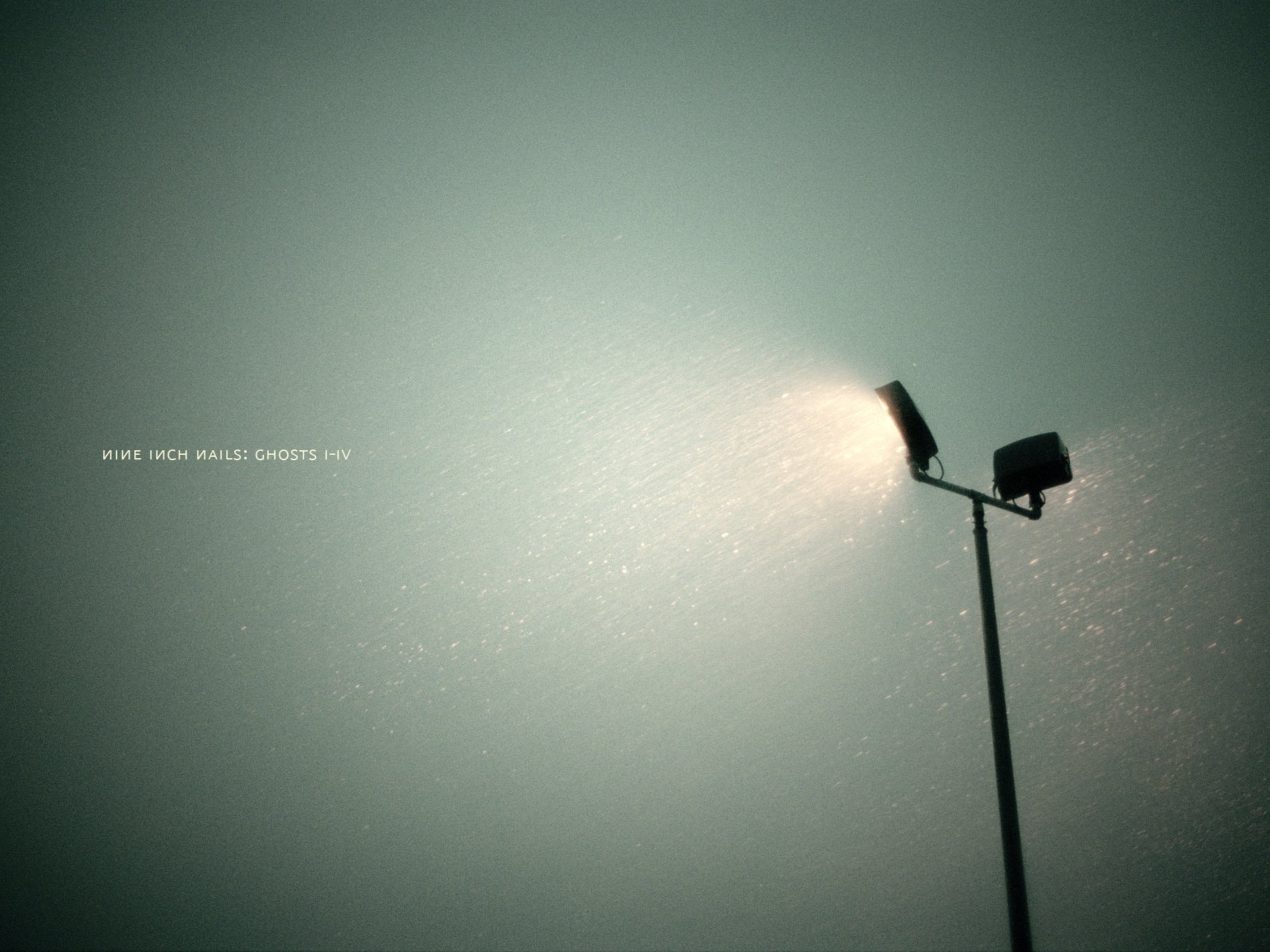 HD PC desktop wallpaper featuring a minimalist, moody light post with subtle text referencing Nine Inch Nails music.