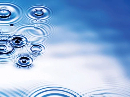 HD desktop wallpaper featuring ripples from water droplets in a serene blue setting, highlighting the beauty of nature.
