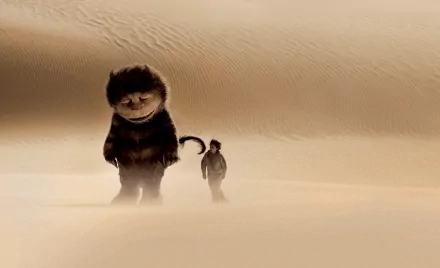 A scene from the movie Where the Wild Things Are, featuring a large creature and a small figure walking through a vast, sandy landscape. HD PC desktop wallpaper and background.
