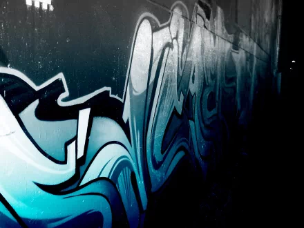 HD desktop wallpaper featuring artistic, blue-toned graffiti on a dimly lit wall, creating an urban and creative atmosphere.