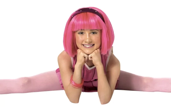 An HD desktop wallpaper featuring a character from the TV show LazyTown, showcasing a girl with a pink bob hairstyle, dressed in a pink outfit, smiling while performing a split.