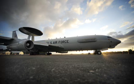 A Boeing E-3 Sentry aircraft is showcased against a dramatic sky, highlighting its role in military operations. This HD image serves as a striking desktop wallpaper and background.