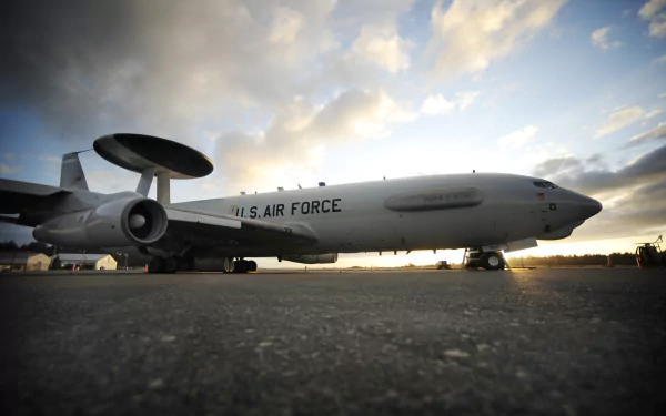 A Boeing E-3 Sentry aircraft is showcased against a dramatic sky, highlighting its role in military operations. This HD image serves as a striking desktop wallpaper and background.