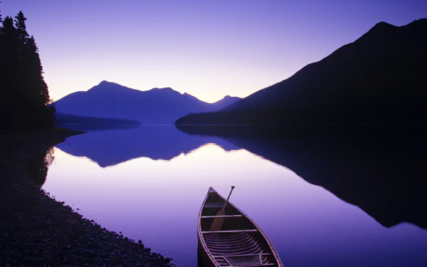 HD PC desktop wallpaper: a boat vehicle rests on a glassy lake at dusk, silhouetted mountains and trees reflected in a purple-hued sky.