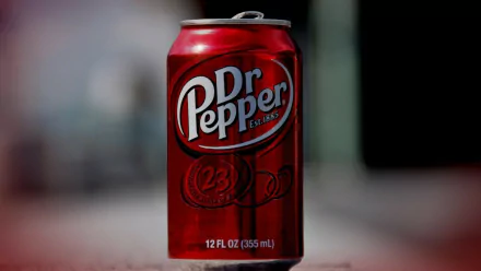 HD PC desktop wallpaper featuring a man-made close-up of a red Dr Pepper soda can on a blurred background.
