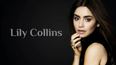 A stylish HD desktop wallpaper featuring celebrity Lily Collins, showcasing her elegant pose and captivating expression against a dark background.