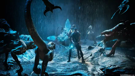 HD wallpaper featuring a scene from Riddick with the main character standing defiantly among menacing alien creatures in a dark, rainy setting.
