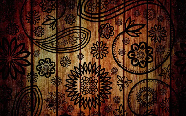 HD desktop wallpaper featuring an artistic and vibrant floral pattern etched on a wooden texture.