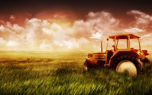 HD PC desktop wallpaper featuring a tractor in a vast grassy field under a dramatic sky at sunset.